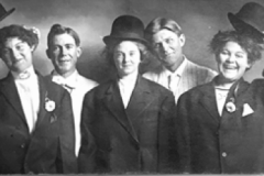 Dora Schum Barclay and other women cutting up at a wedding.